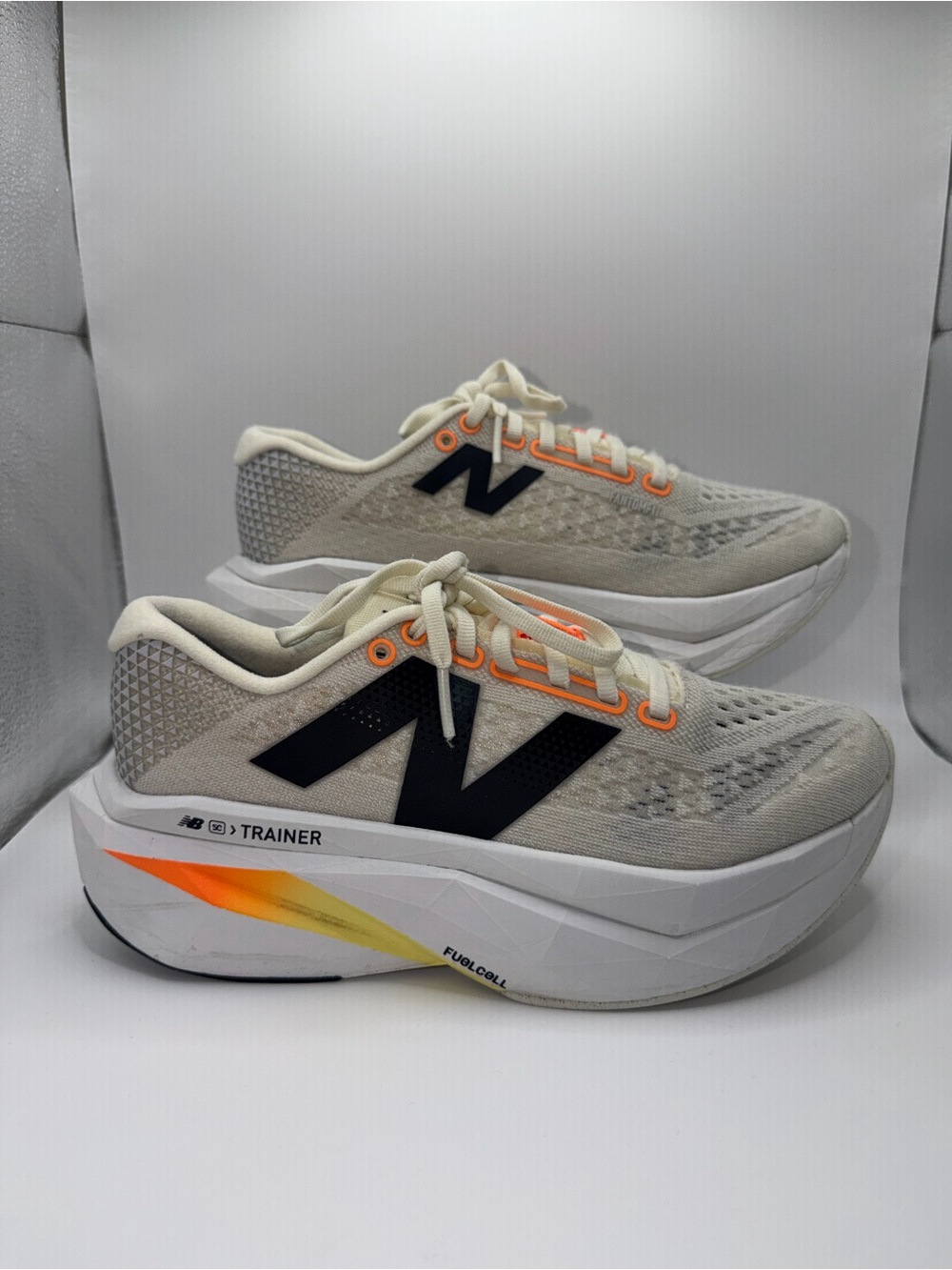 New Balance Cream and Black Athletic Trainers with Orange Accents